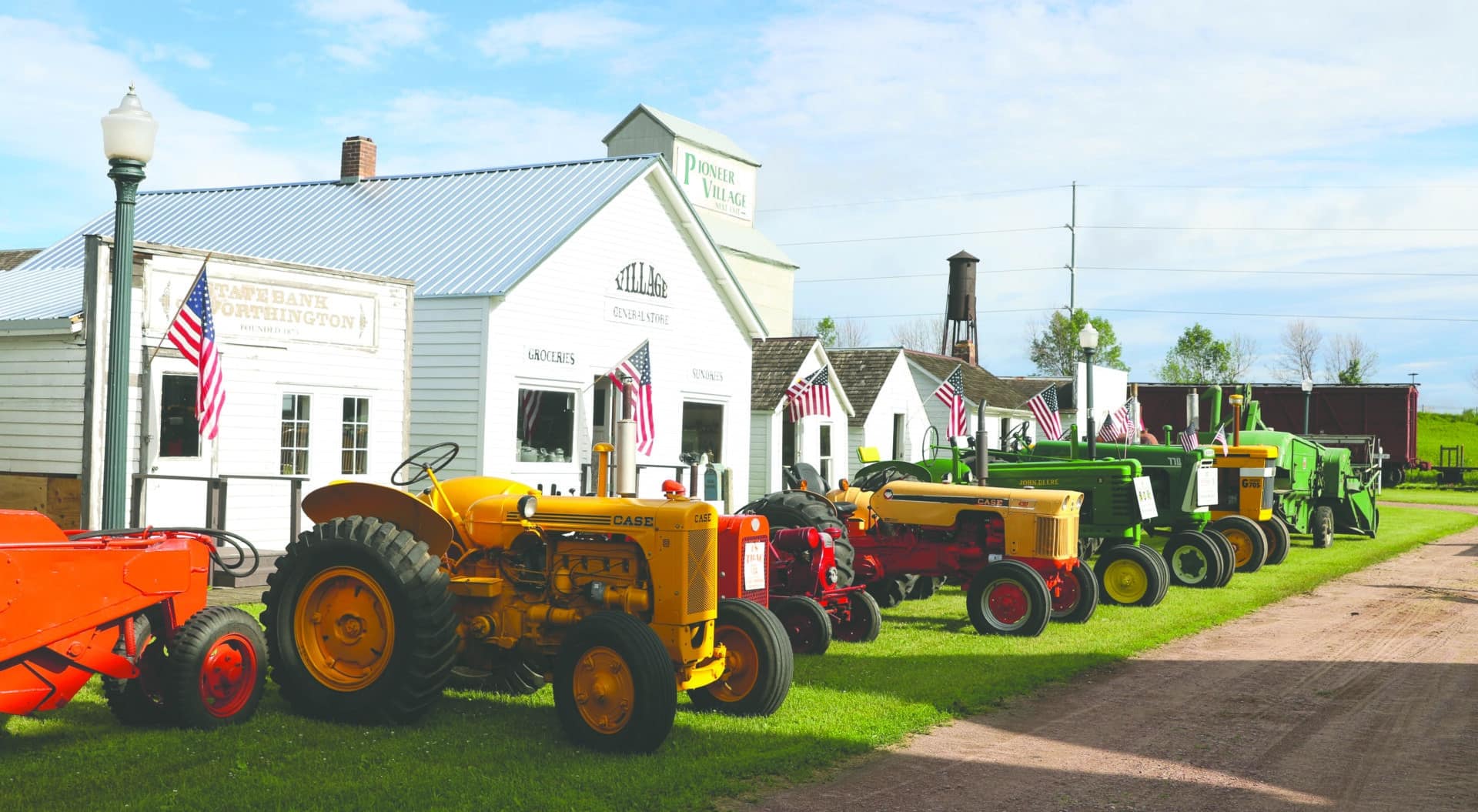 pioneer village with vintage tractors