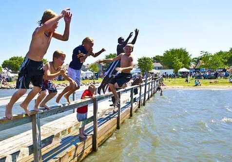 lake okabena children jumping in lake