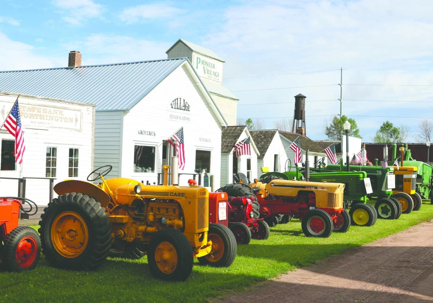 pioneer village with vintage tractors